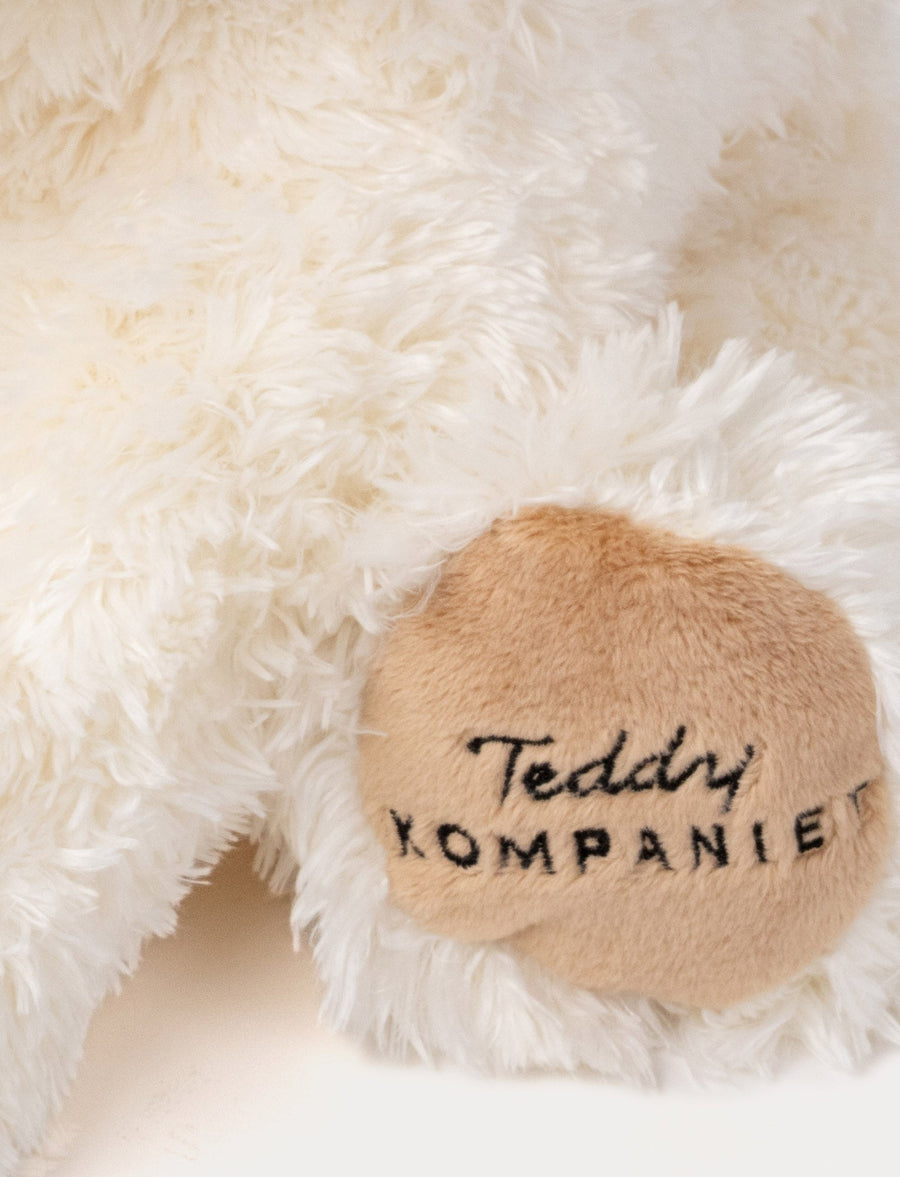 Selma hundebamse krem 35 cm fra Teddykompaniet – bakside og brodert pote