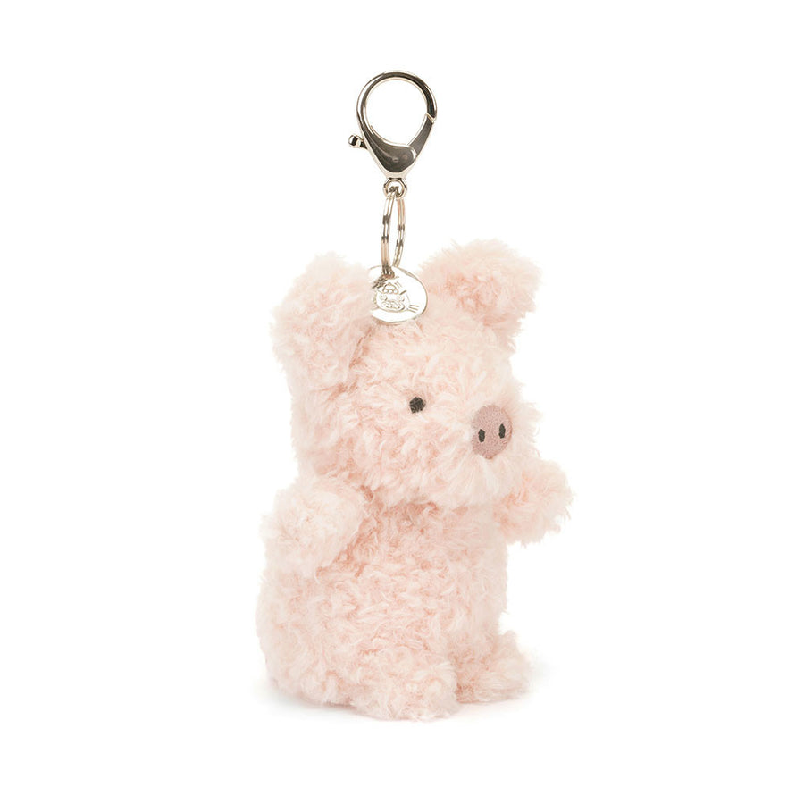 Jellycat Little Pig Bag Charm detalj – nærbilde av smilende griseansikt og metallfeste